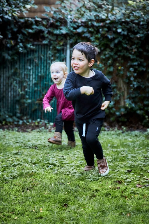 Child exploring with joyful outdoor energy in daylight