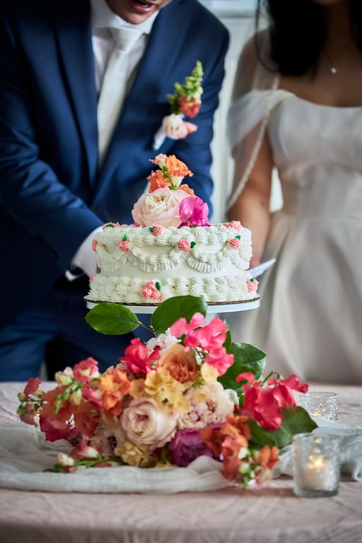 Couple surrounded by loved ones during a joyful wedding celebration