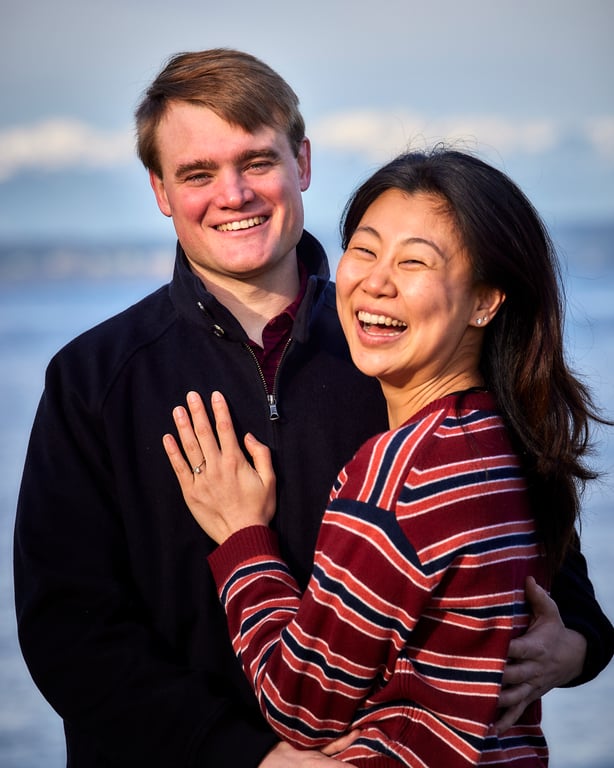 Couple embracing in warm golden hour light during their session