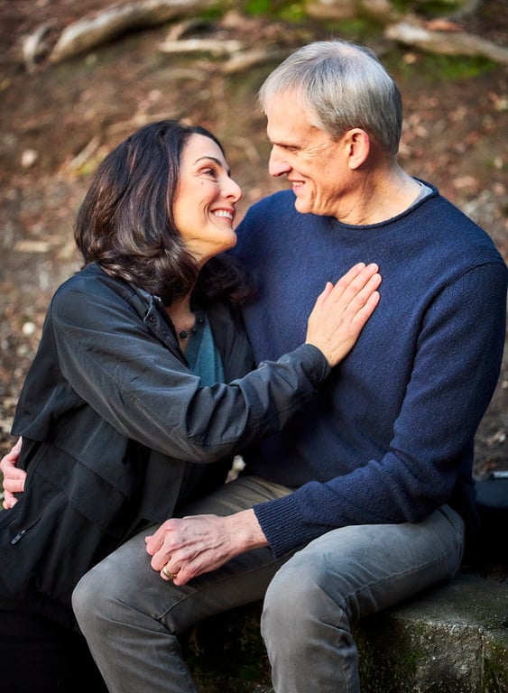 Relaxed outdoor couples embrace in a peaceful natural setting