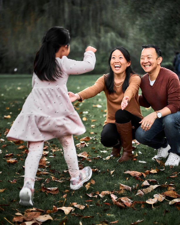 Family standing close together with warm welcoming expressions