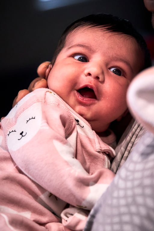 Young child in a playful candid moment with bright eyes