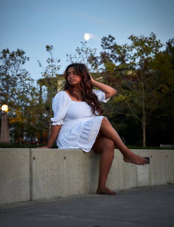 Relaxed pose captured in a warm ambient outdoor glow