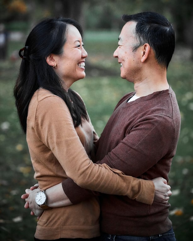 Couple posed close together with warm affectionate expressions