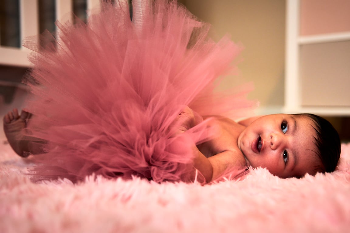 Baby in a candid moment of pure discovery and wonder