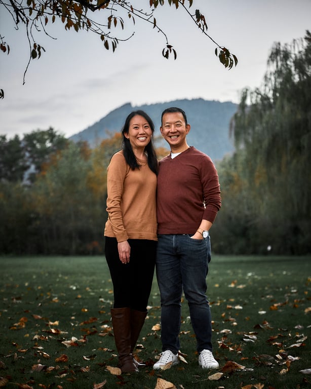 Couple laughing together during a candid exchange outdoors