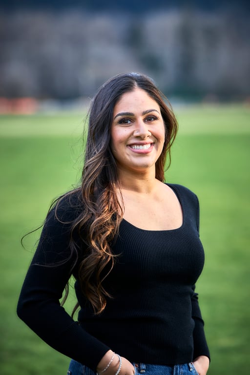 Bright outdoor portrait with a genuine carefree smile and warm daylight