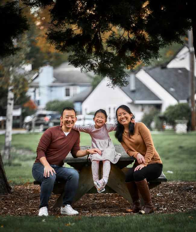 Family sharing a joyful moment bathed in golden hour light