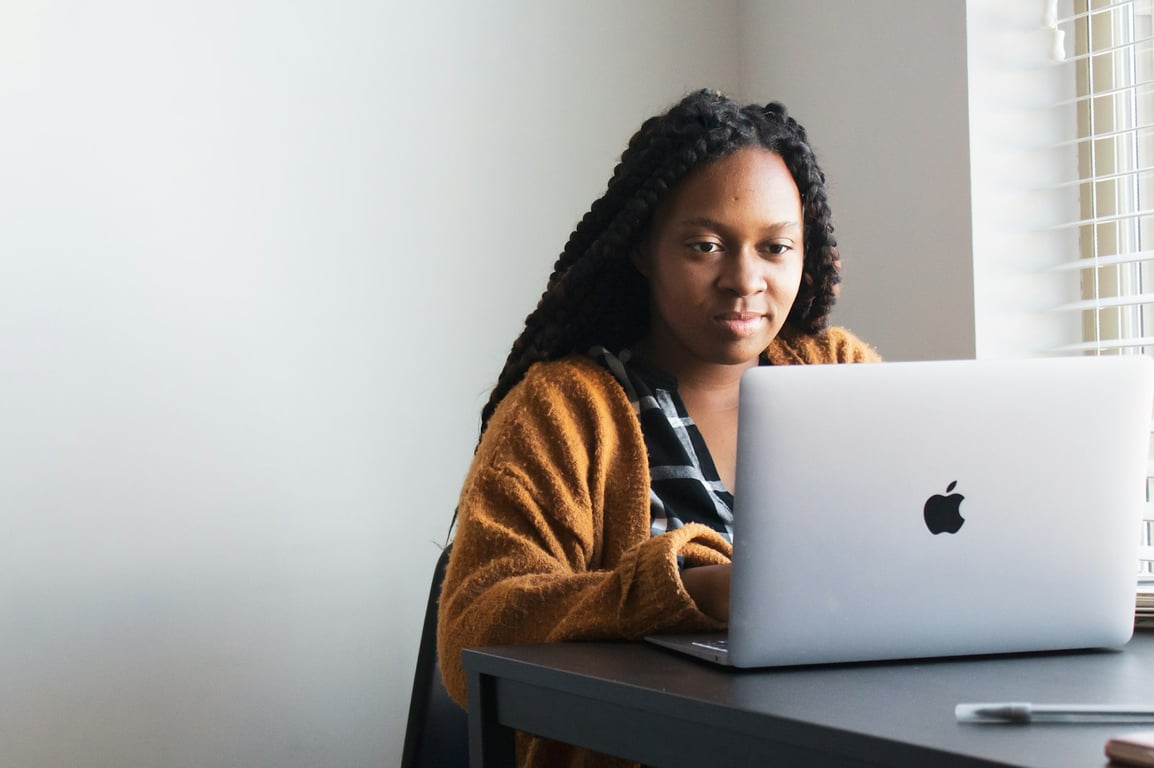 Student studying on a laptop at a desk
