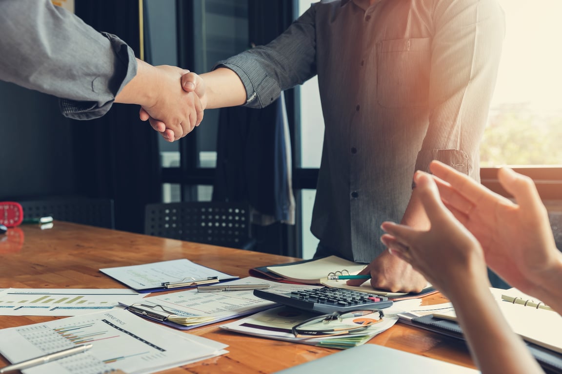 Image of business professionals shaking hands