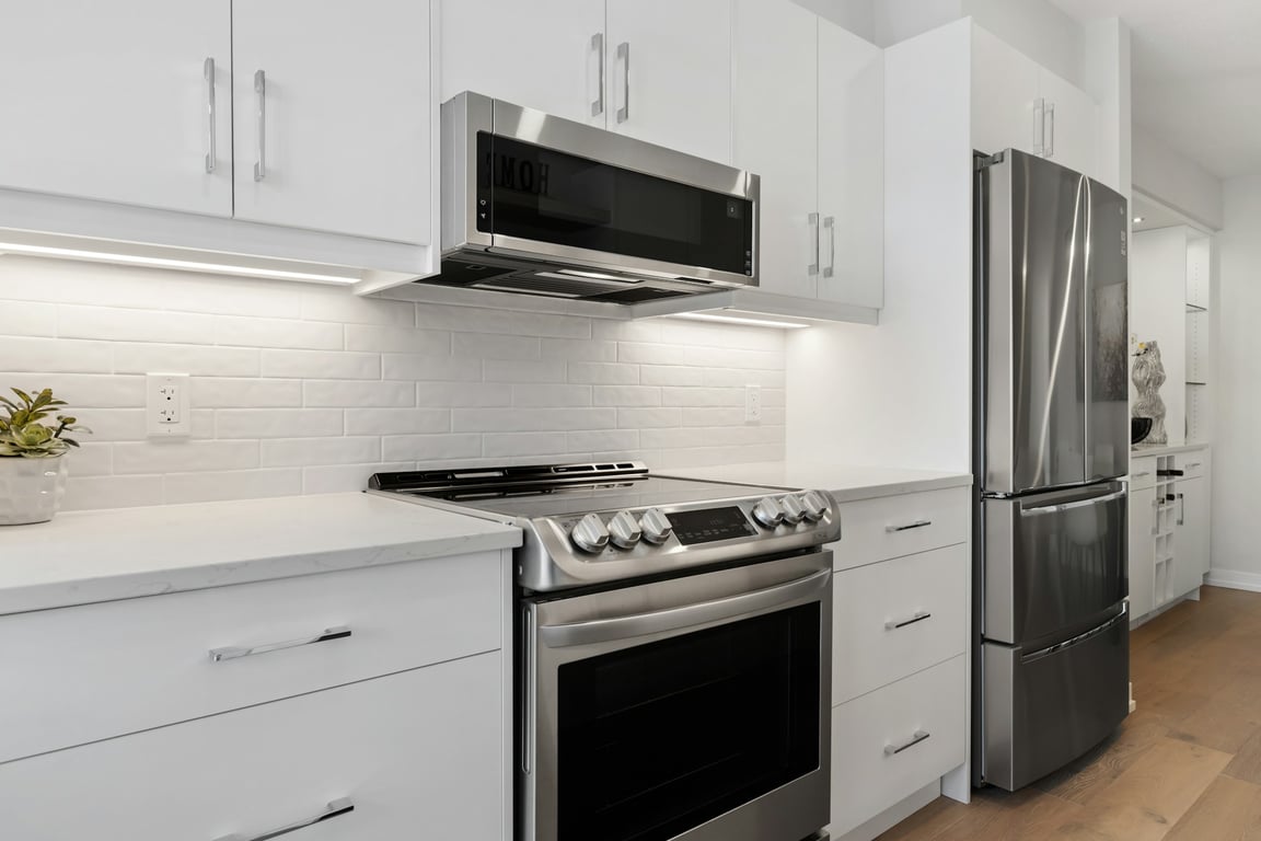 Modern stainless steel French-door refrigerator in a bright kitchen