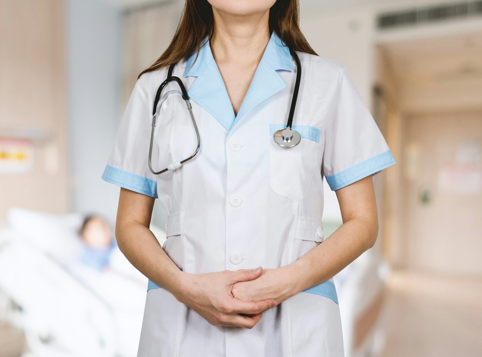 Nursing student with a stethoscope studying coursework