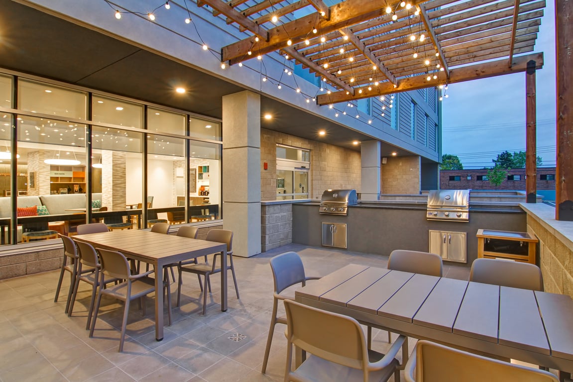 Exterior Patio BBQ | Home2 Suites by Hilton Montreal Dorval