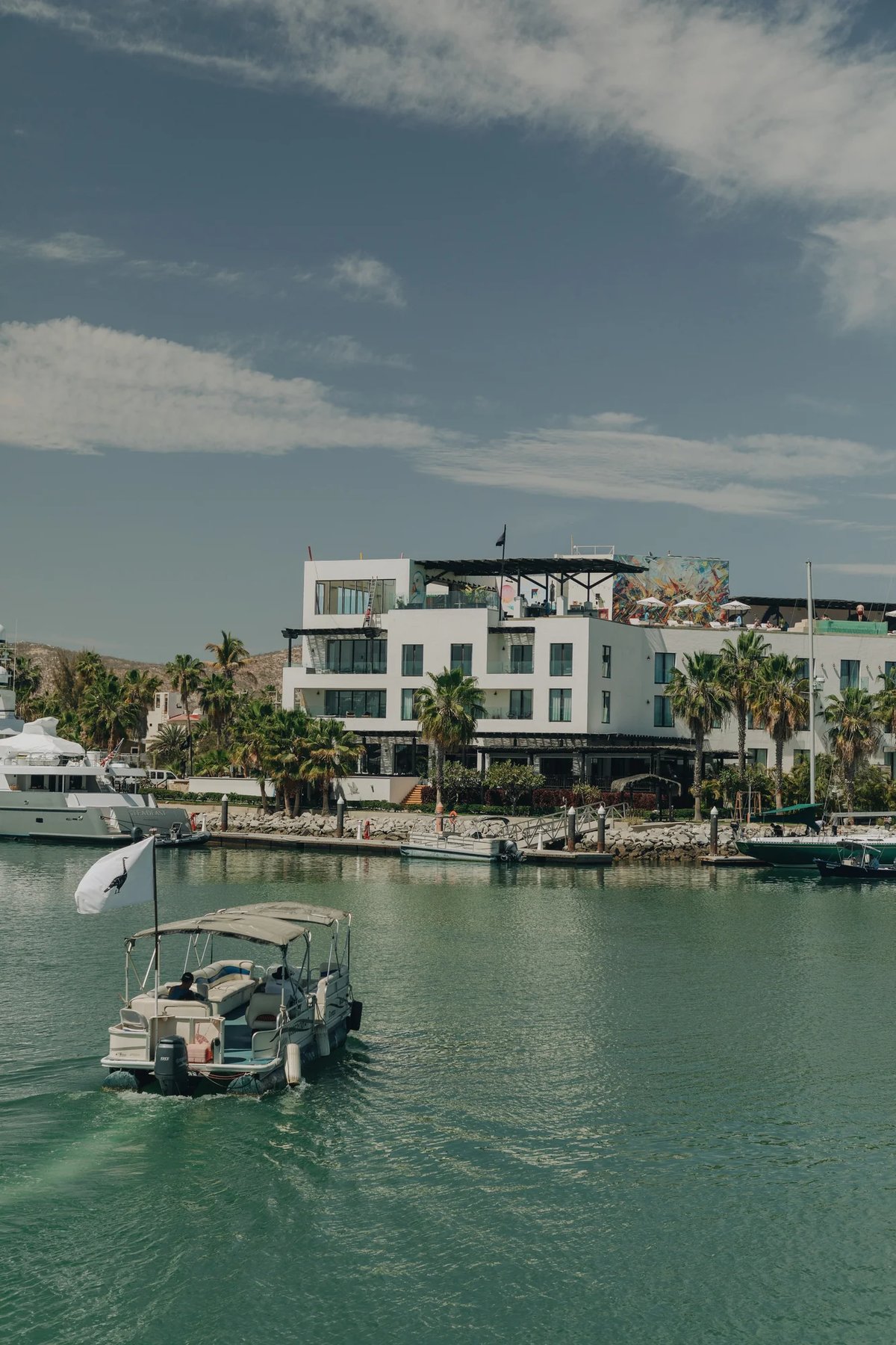 https://imagedelivery.net/jHDmI3UpXy0vHMoFeeZZfg/elganzo-amenity-water-open-skies-boat-taxi-hero-image/