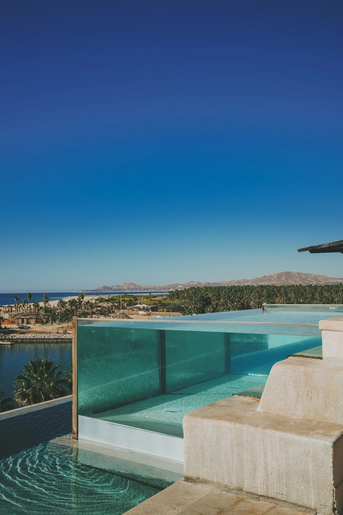 https://imagedelivery.net/jHDmI3UpXy0vHMoFeeZZfg/elganzo-amenity-water-open-skies-rooftop-jacuzzi-hero-image/