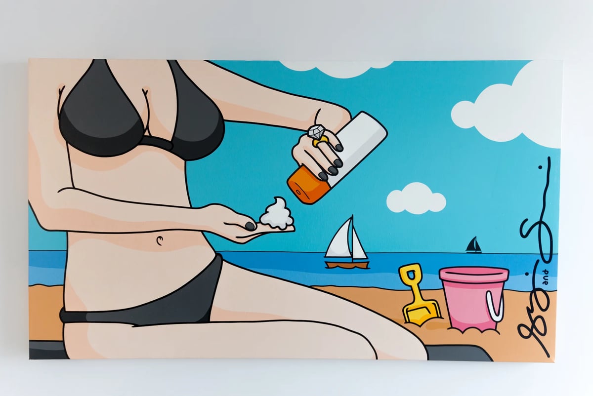 WOMAN APPLYING SUNBLOCK