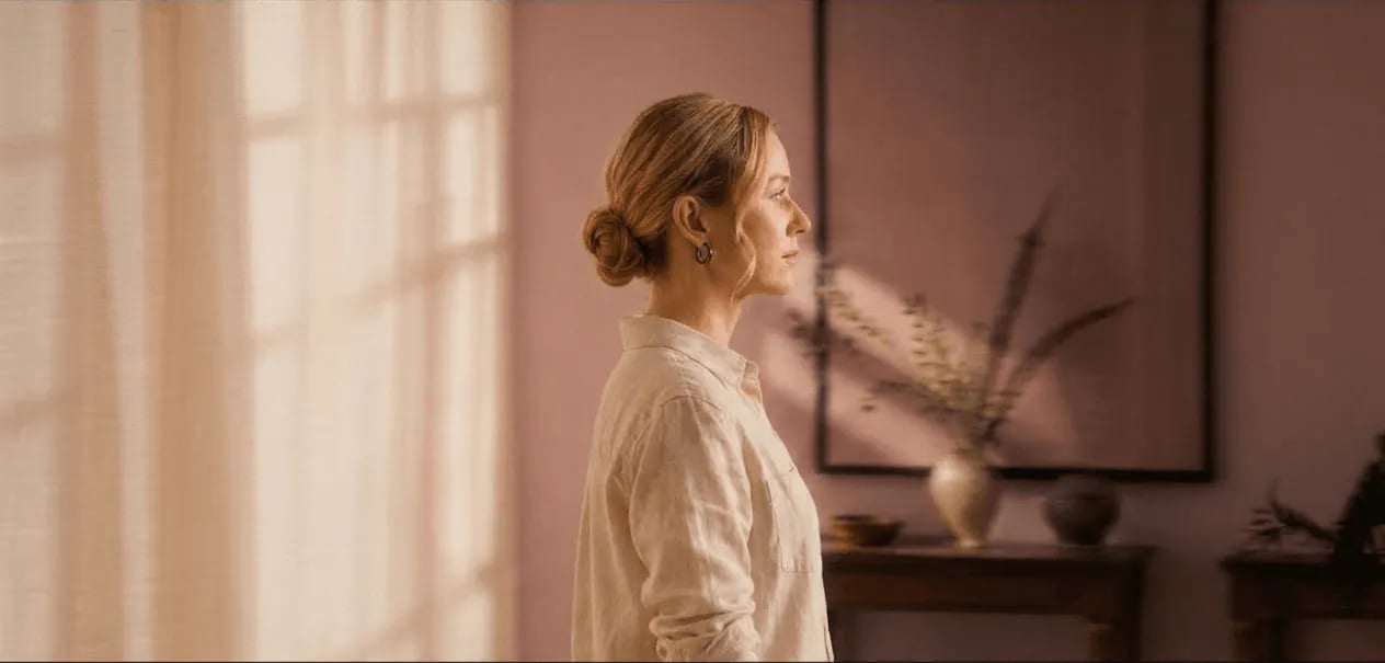 Woman in a warm terracotta room