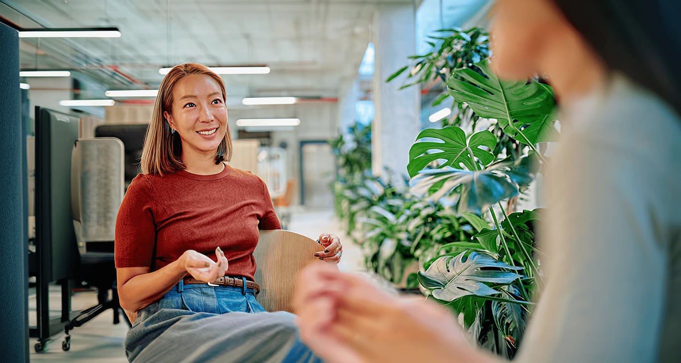 Member smiling mid-conversation while recommending Meto to a friend