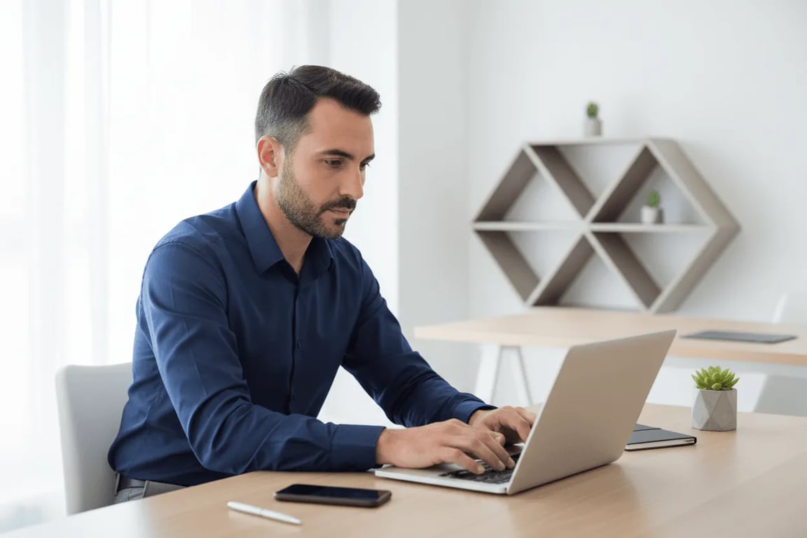 Med-spa operator at his laptop