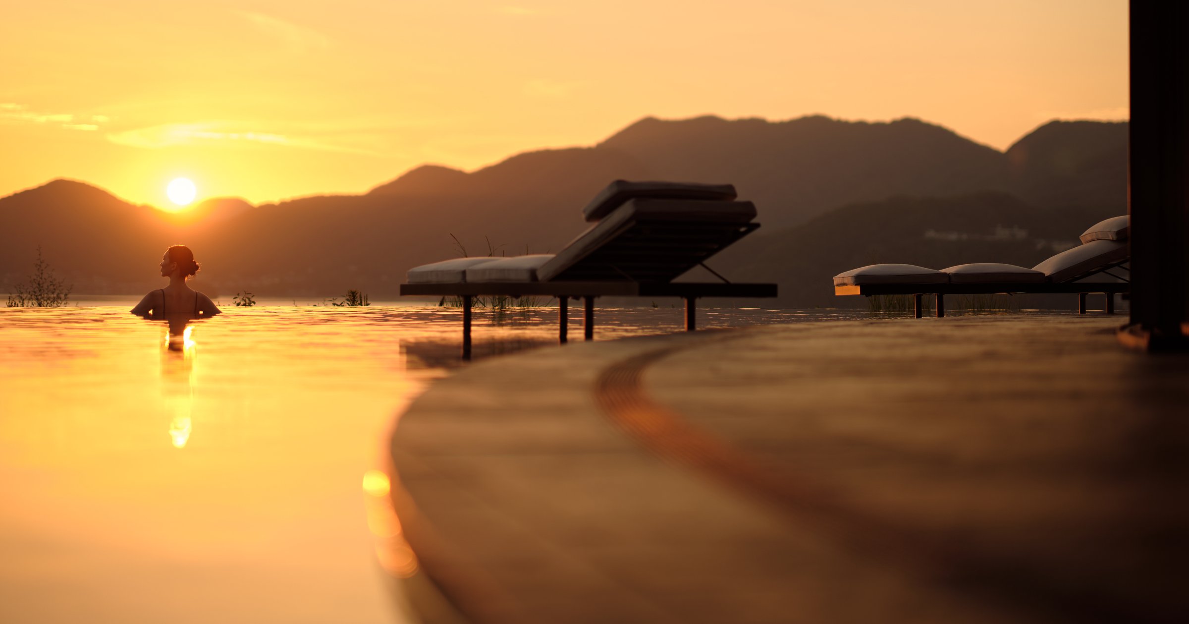 Spending time at an infinity pool at dusk