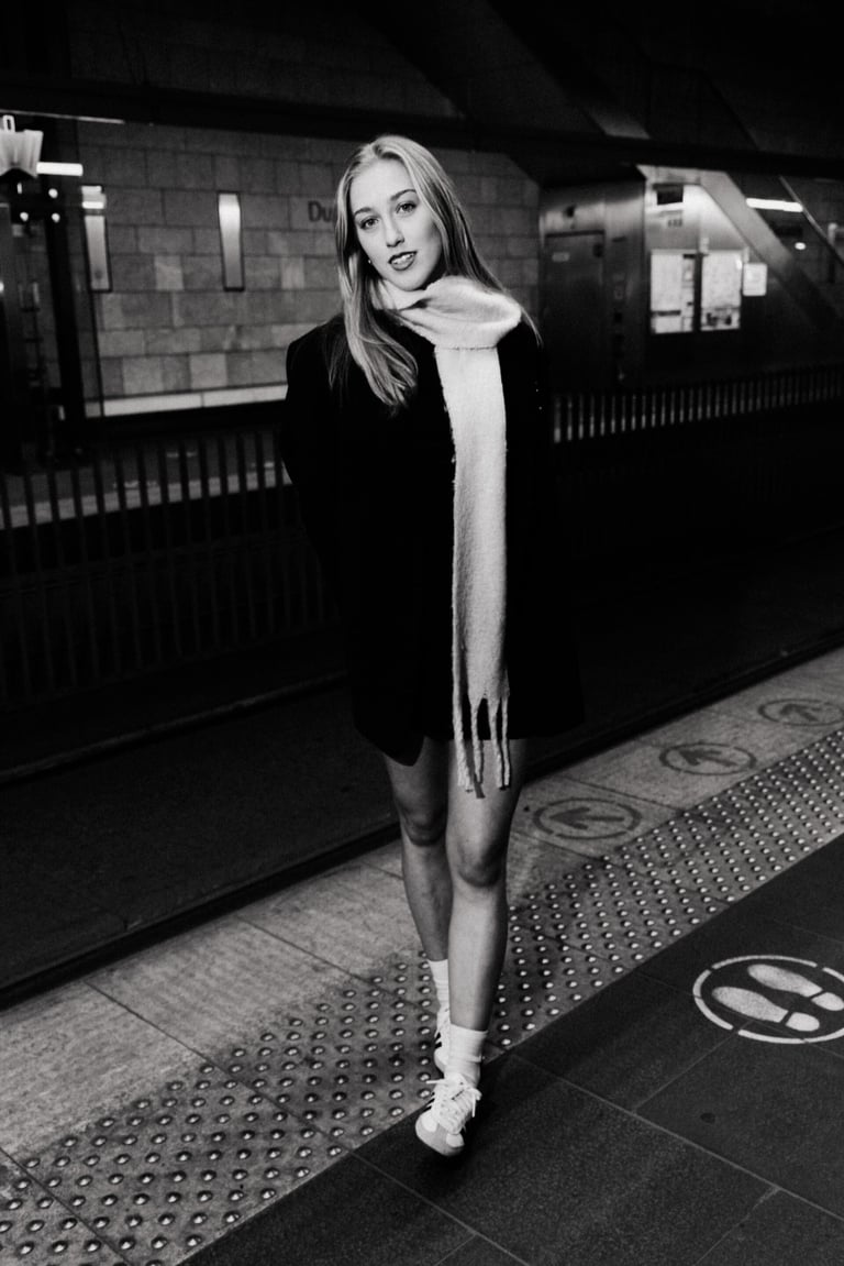 Woman on a platform with a scarf around her neck
