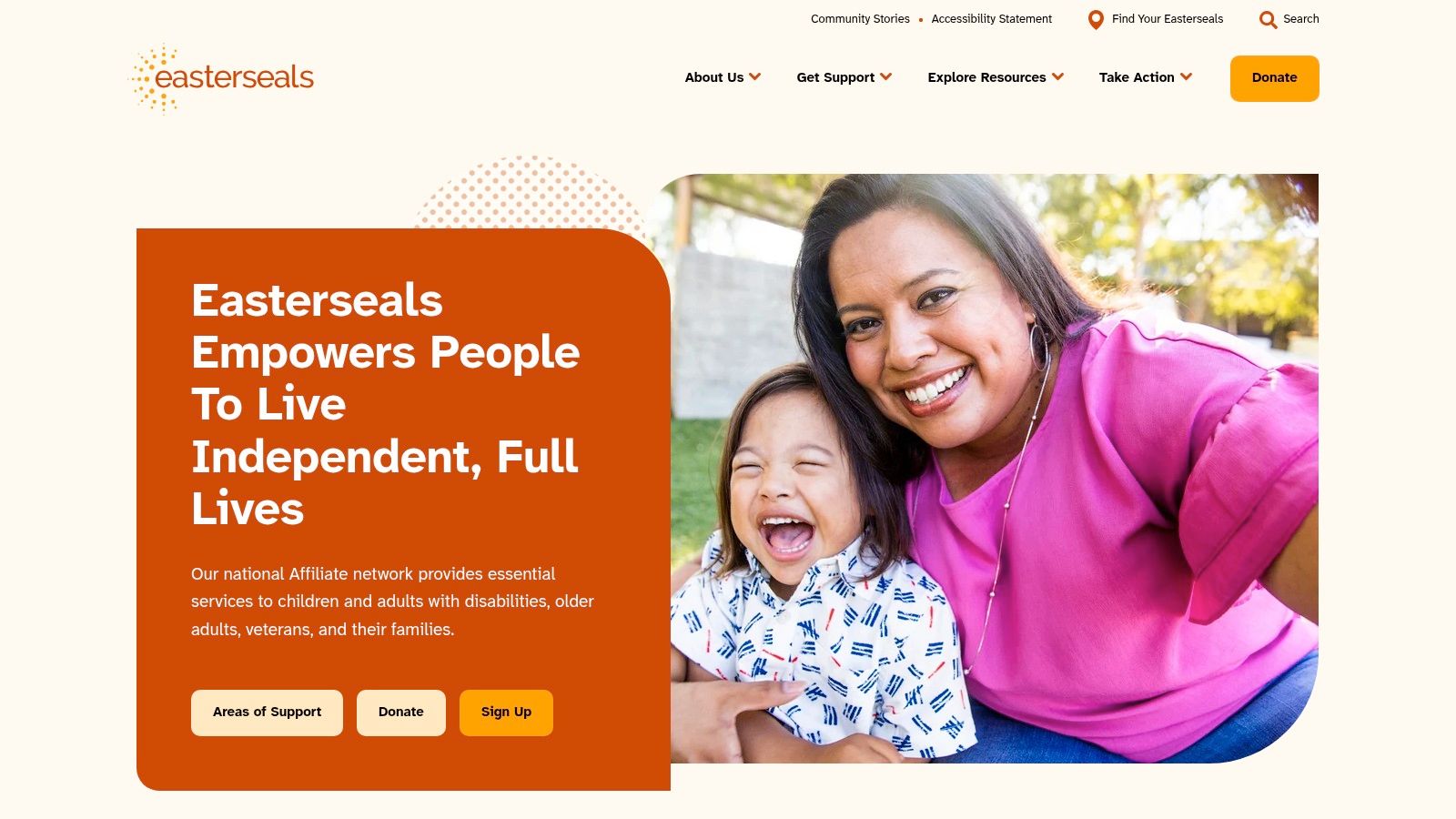 A joyful family with a child who has a disability, smiling together, representing the community and family support aspect of Easterseals.