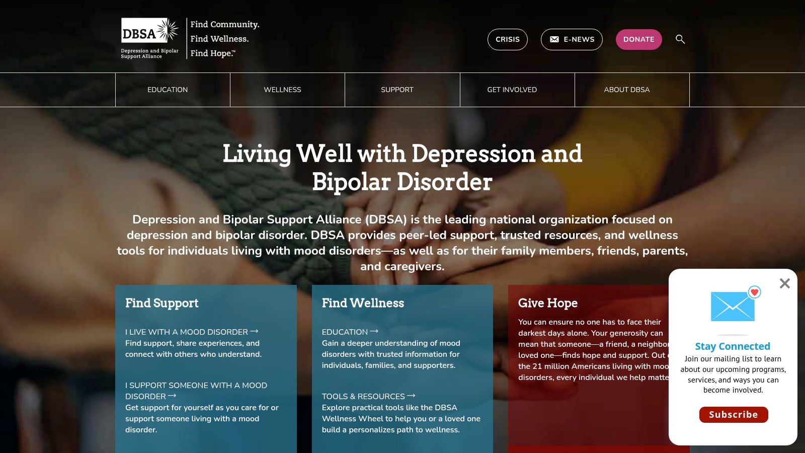 A diverse group of people sitting in a circle during a support group meeting, symbolizing the community and peer support offered by the Depression and Bipolar Support Alliance (DBSA).