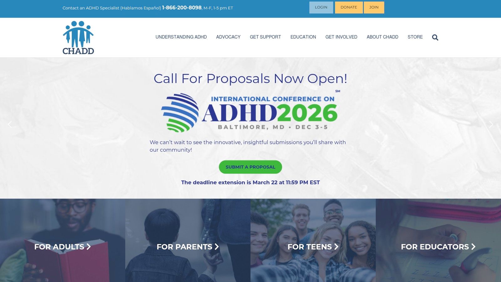 A group of adults at an ADHD conference engage in a discussion, representing the educational and community aspects of CHADD support groups.