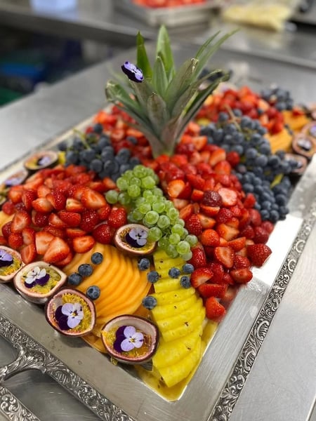 A beautiful fruit platter is essential for the dessert buffet.
