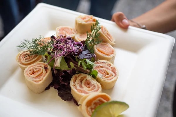 Salmon rolls with cream cheese and herbs not only look beautiful, but also taste great.