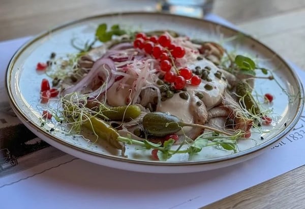 Enjoying vitello tonnato in the garden.