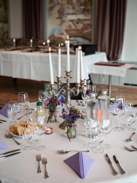 Banquet tables are set with great attention to detail.