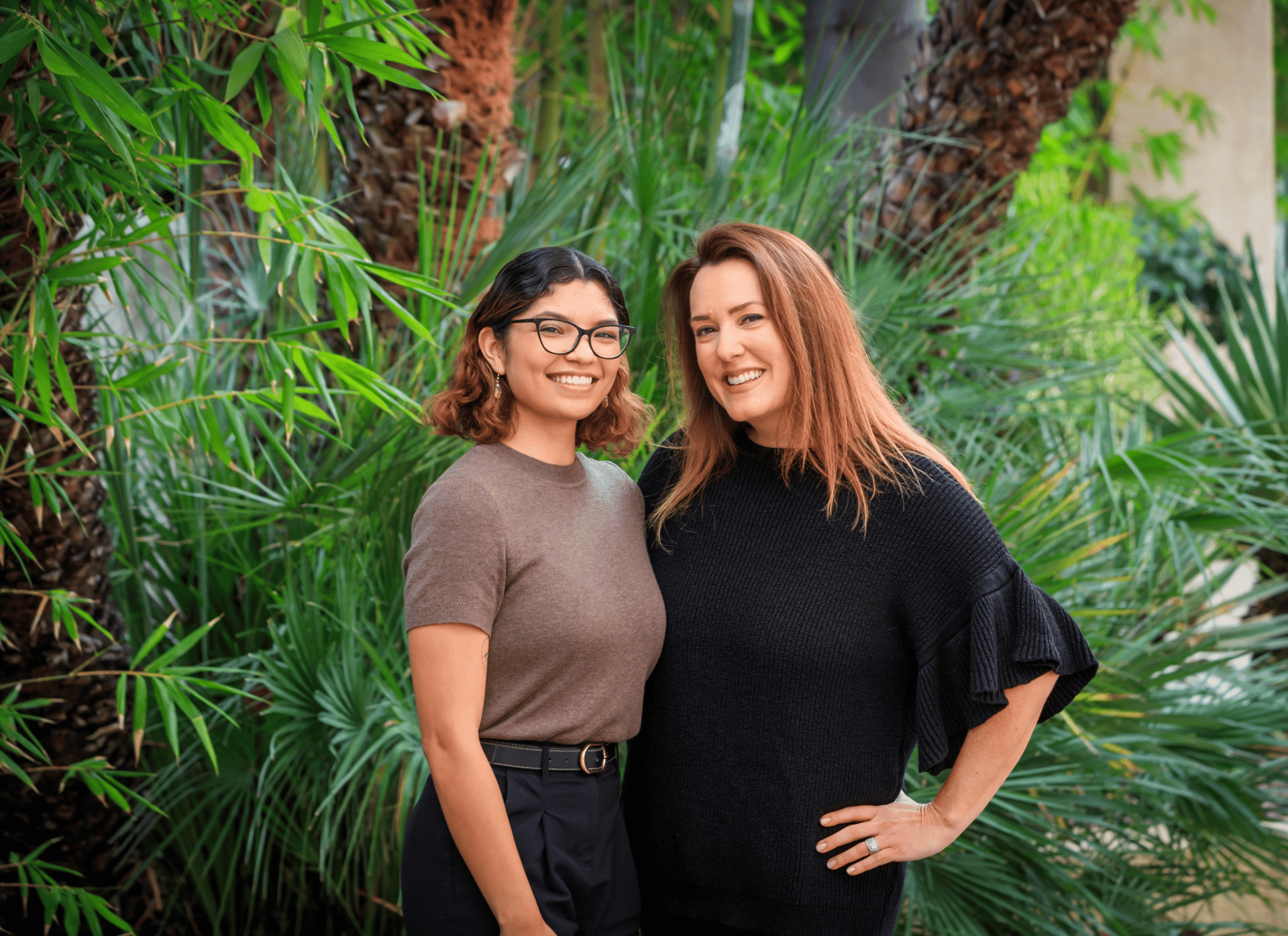 Evening exterior of the venue with porte-cochere lighting and arriving cars.