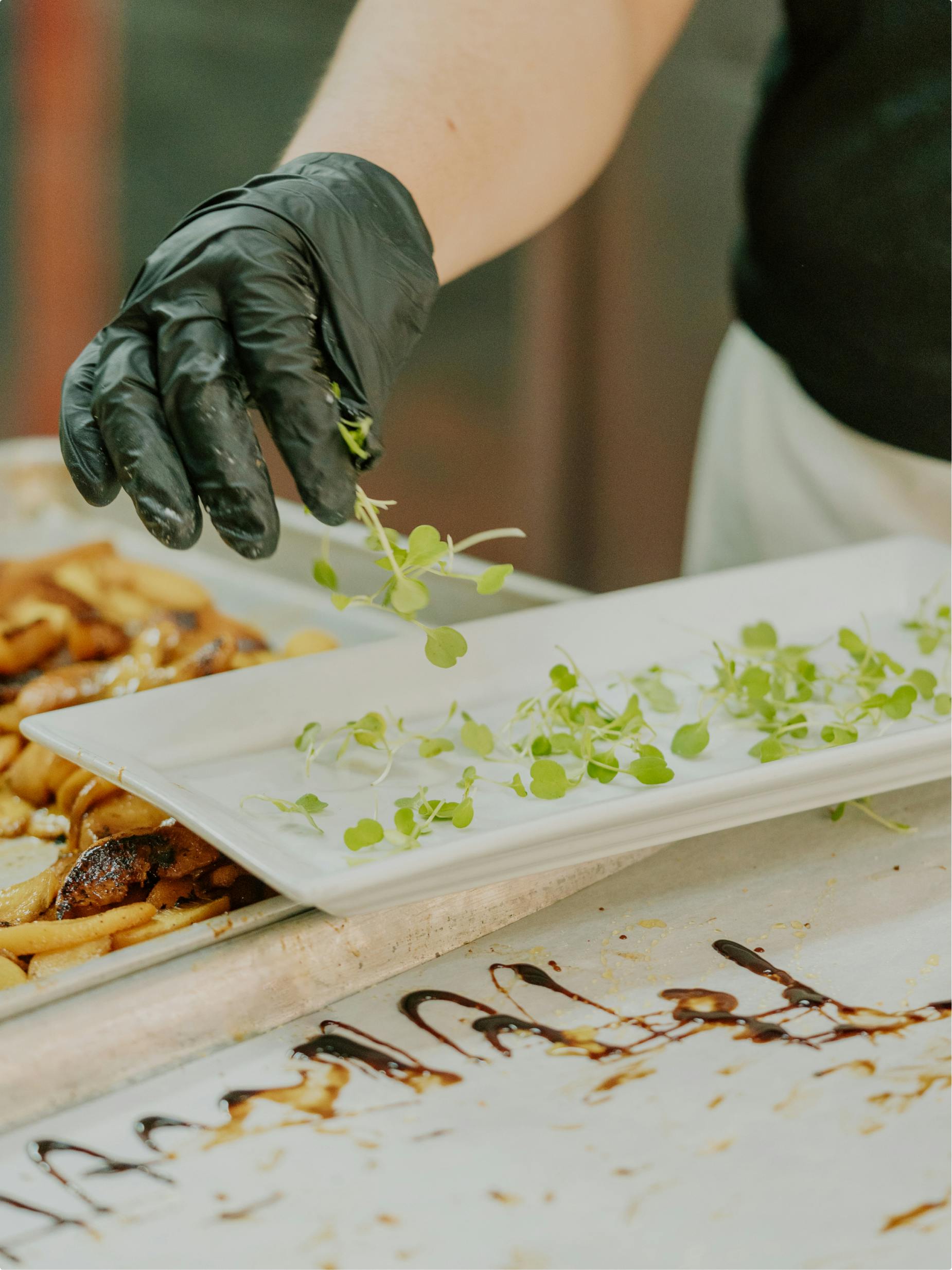 Couple in formal attire dancing closely in a spotlight on the dance floor.