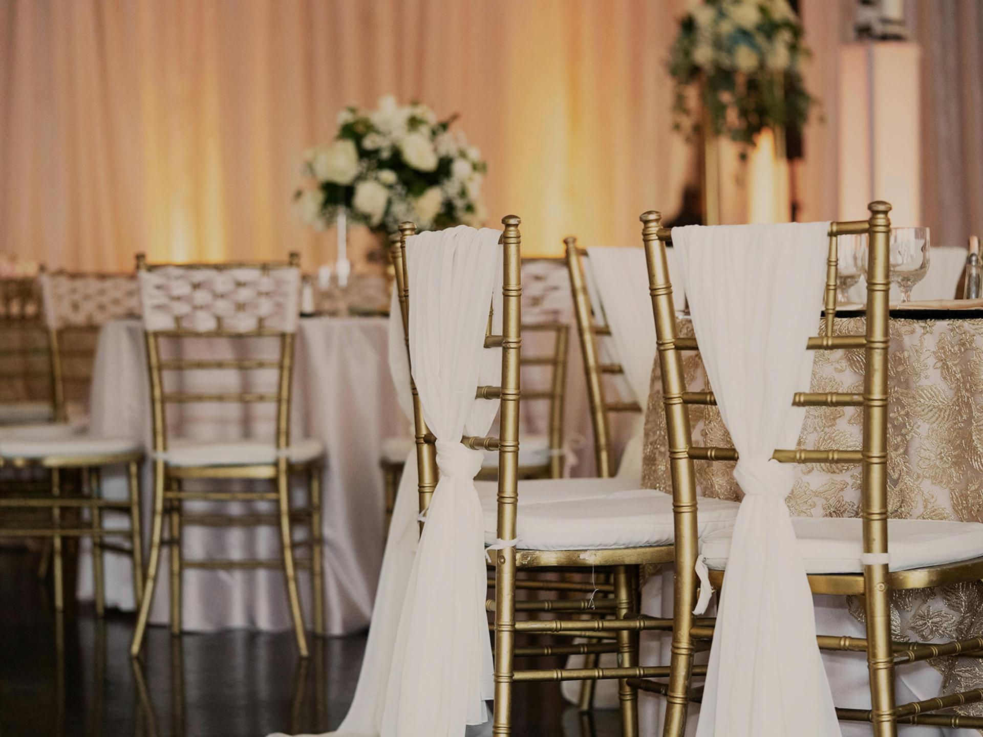 Grand Ballroom with stage, dance floor, and pink uplighting.