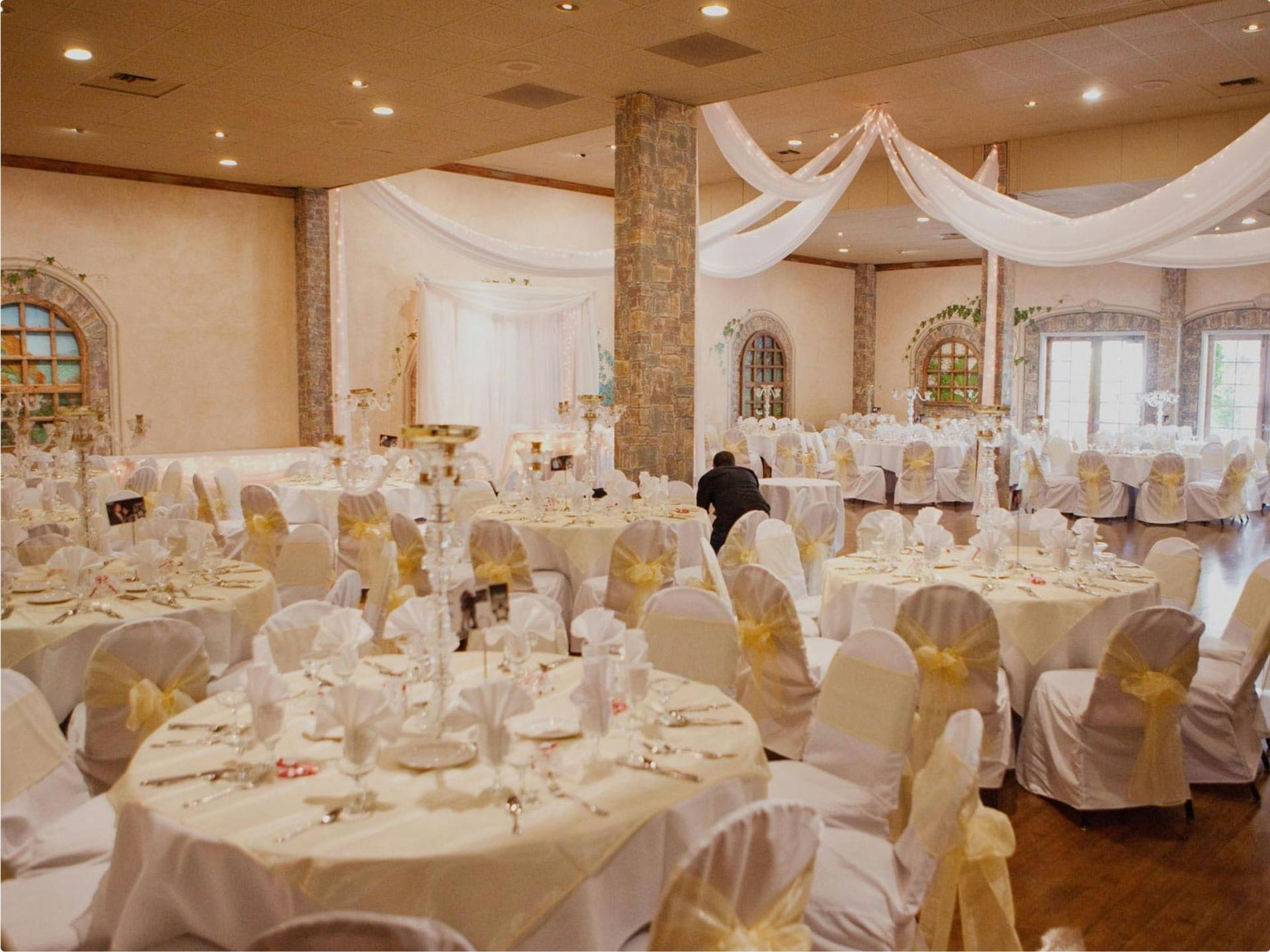 Bride and groom in spotlight on the dance floor.
