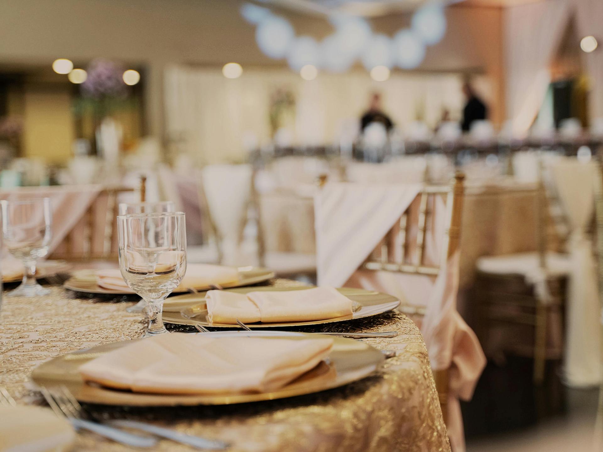 Grand Ballroom with dramatic red uplighting and stage.