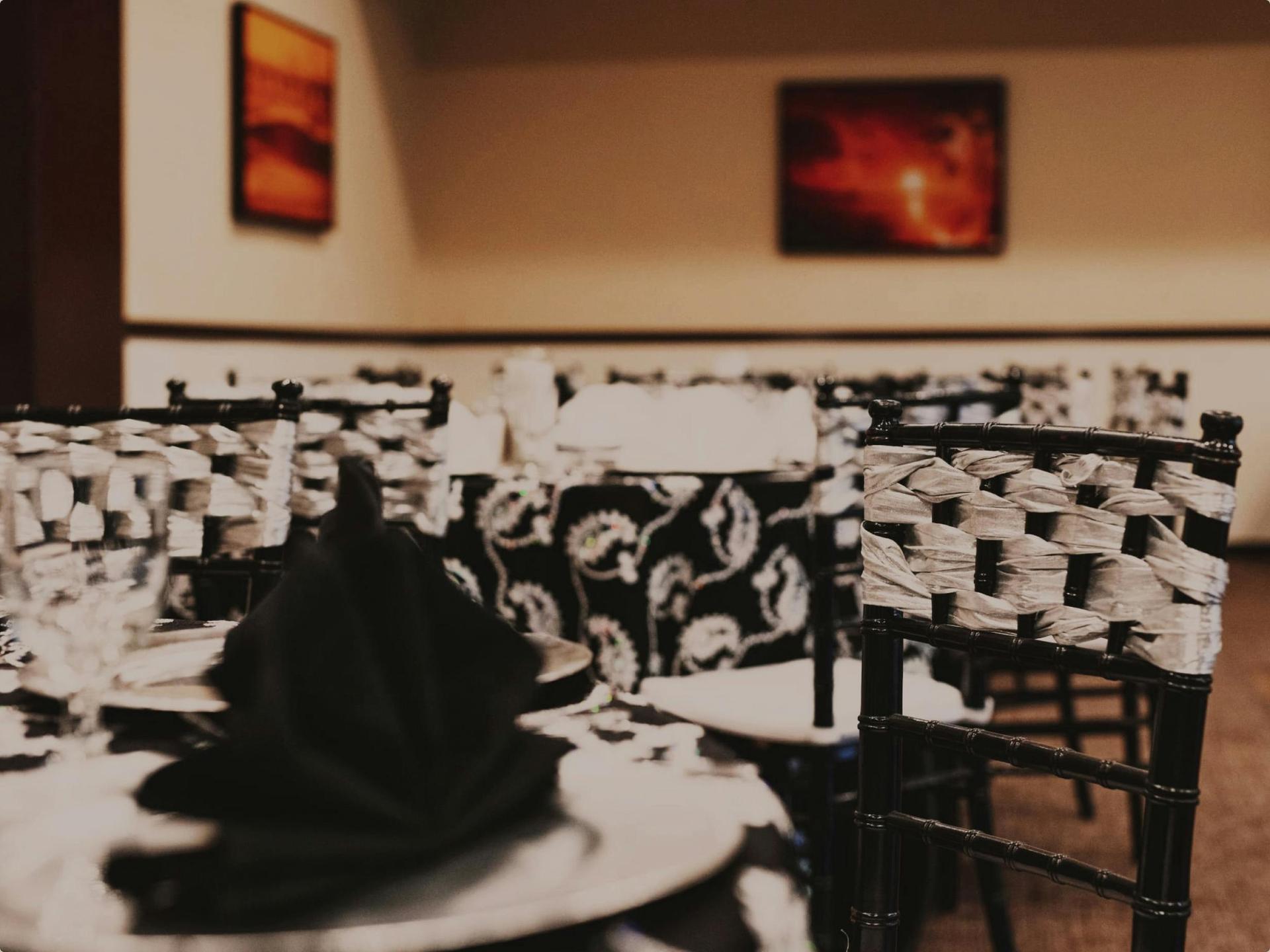 Pacific Room: lounge vignette, bar, and coastal wall art.