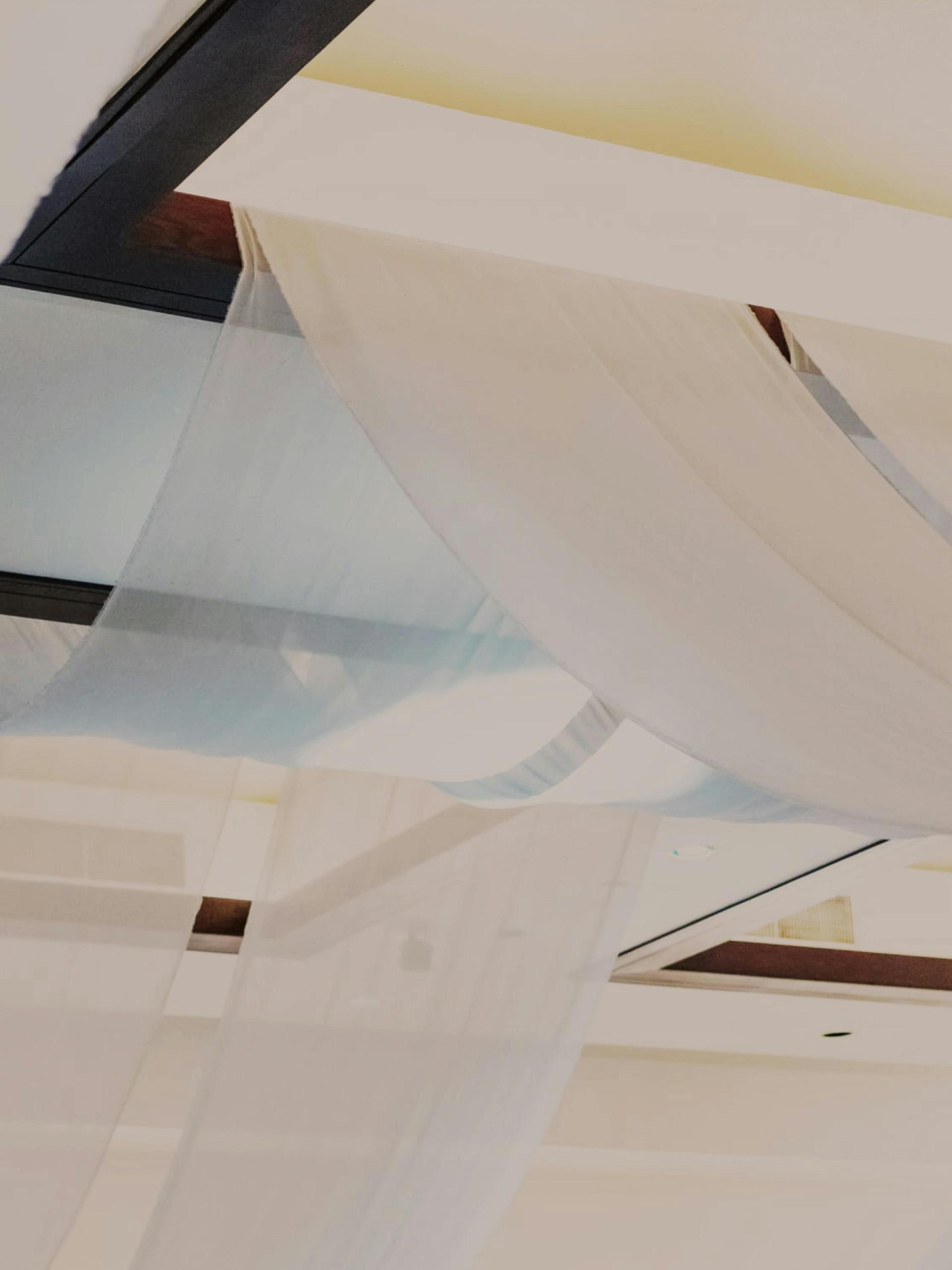 Grand Ballroom with pink and purple uplighting and stage.