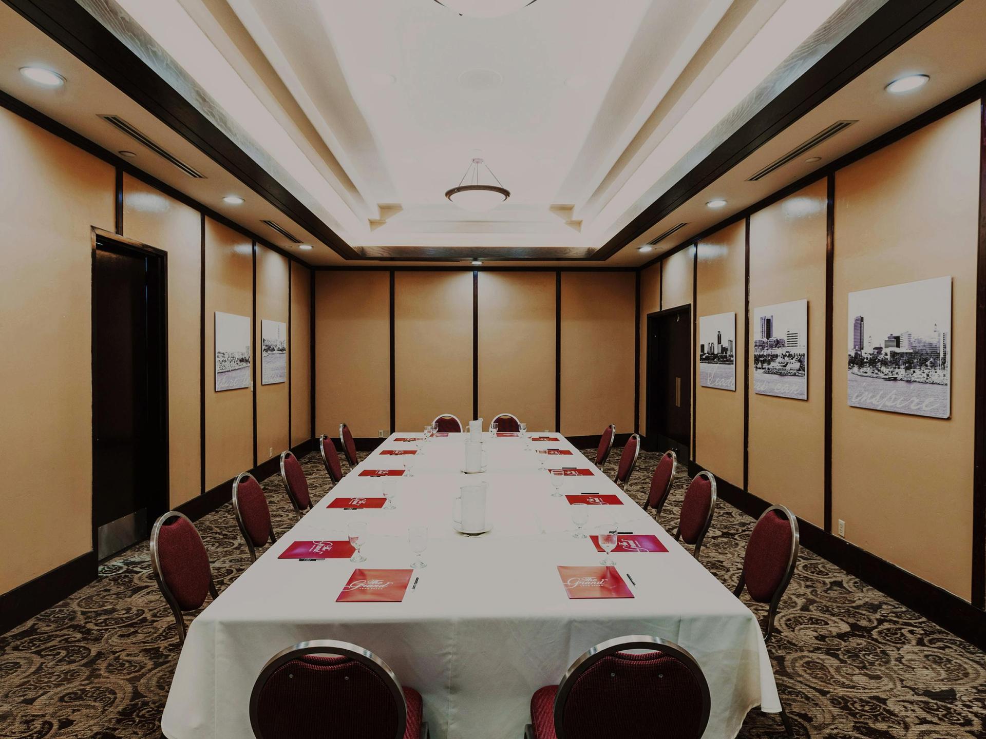 Board Room: mahogany conference table and executive chairs.