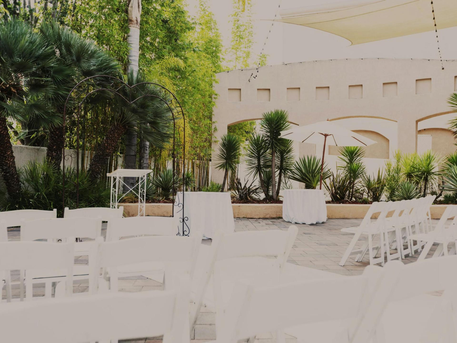 Palm Terrace with market lights and open-air dining.