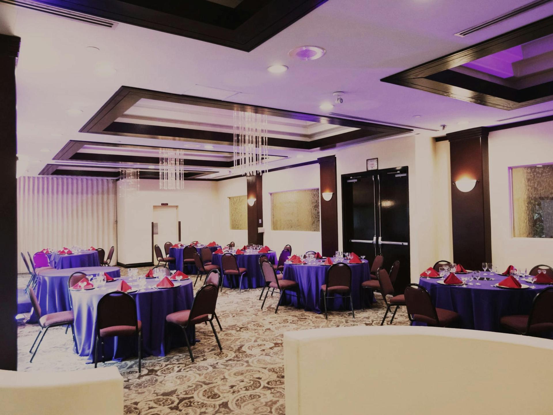 Garden Room with green mural and chandelier (vertical emphasis).