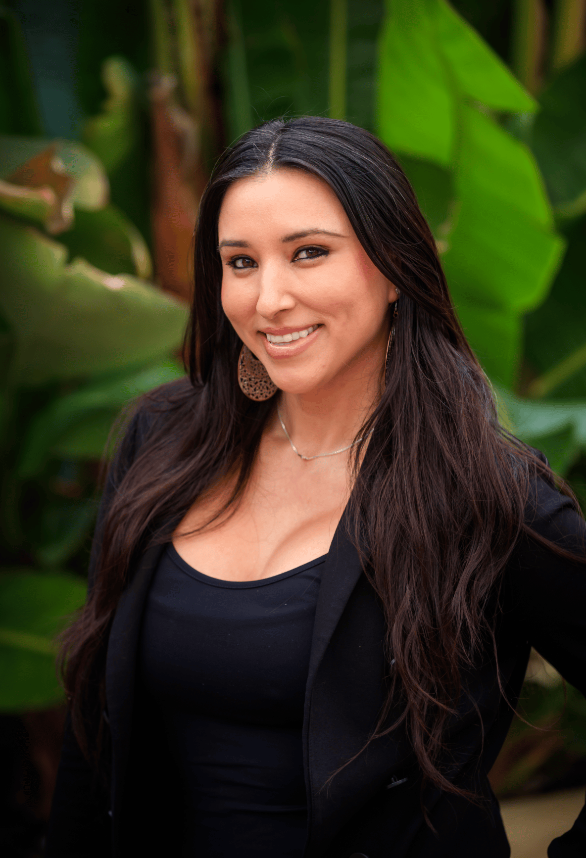 Portrait of a woman in a black blazer (team headshot).