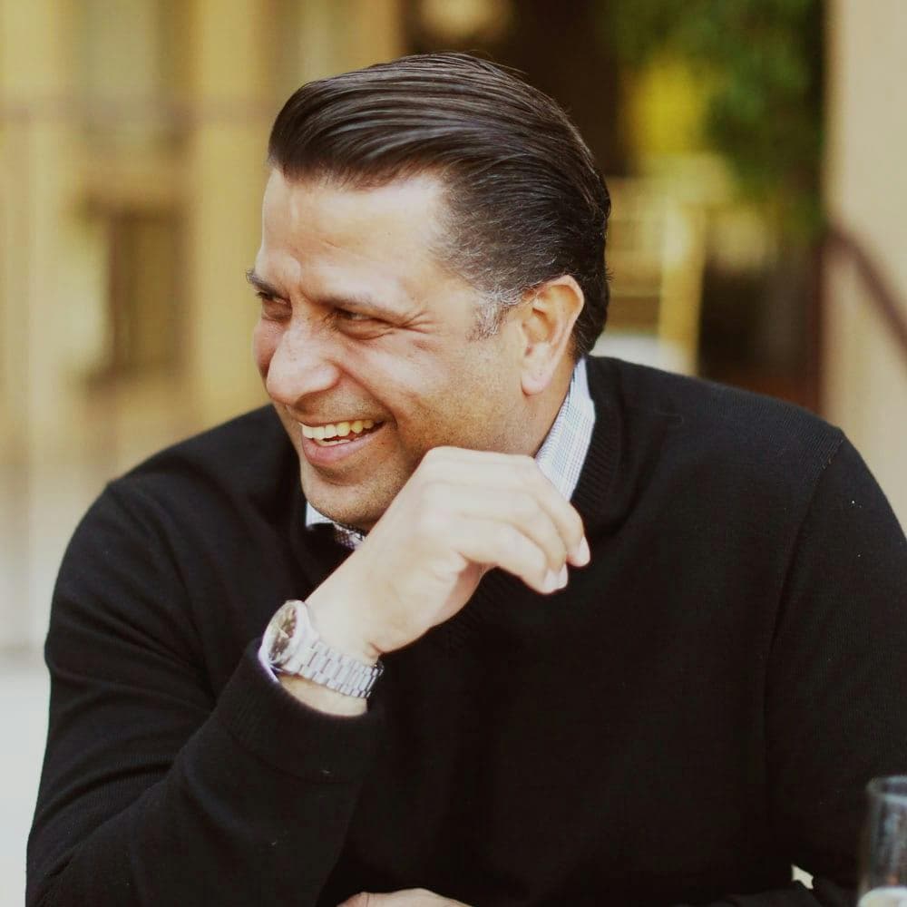 Portrait of a man in a suit (team headshot).