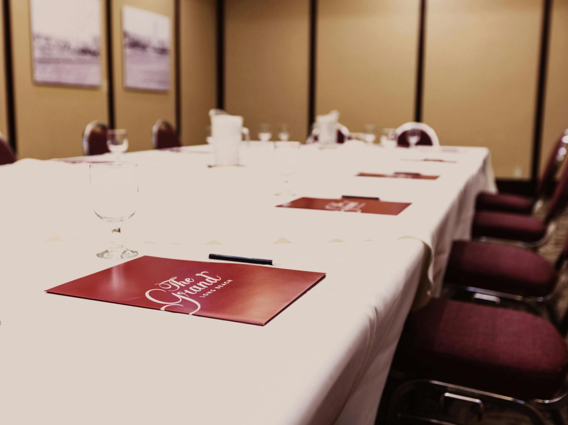 Board Room: mahogany table and leather chairs.