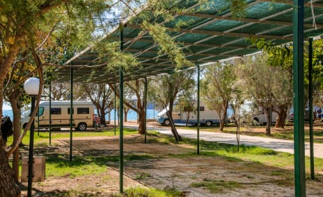 Picture of a Camping pitch under shadow for caravans, campervans and tents.