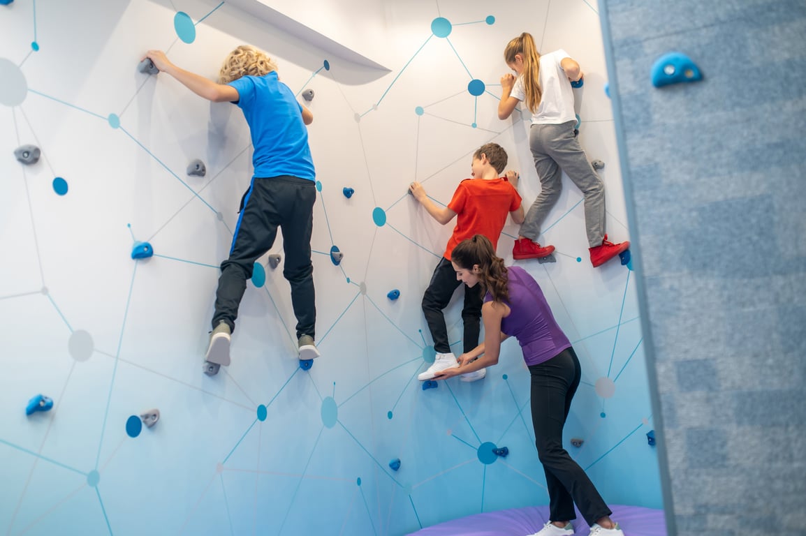 Kids scaling colourful climbing walls at Clip ’n Climb Laval
