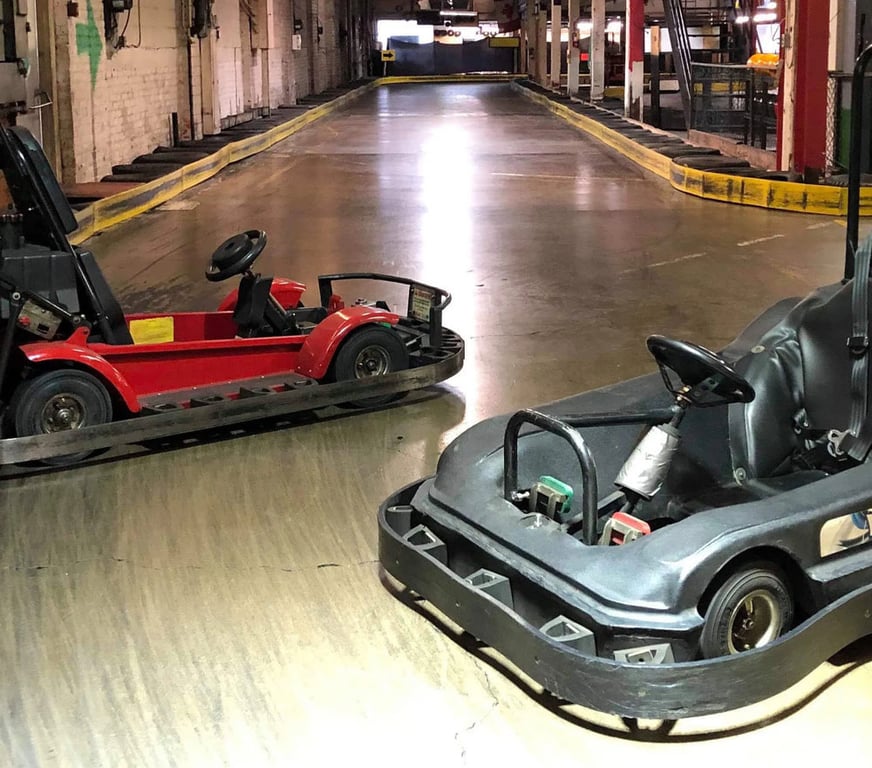 Kids racing at Hamilton Indoor Go Karts.