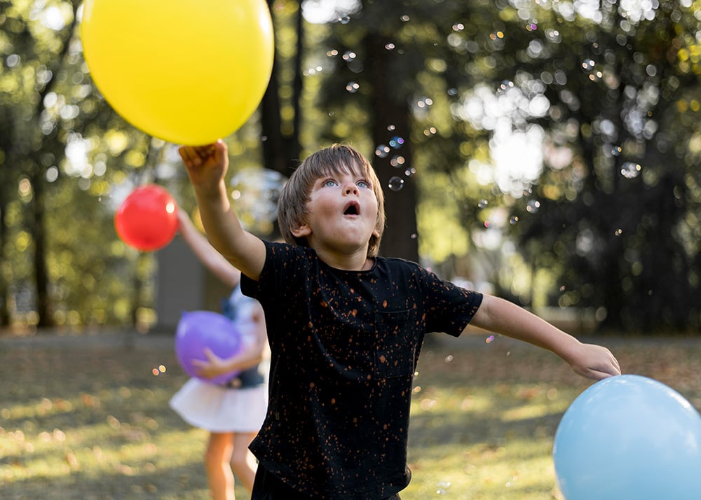 Kids playing with water balloons and outdoor water activities.