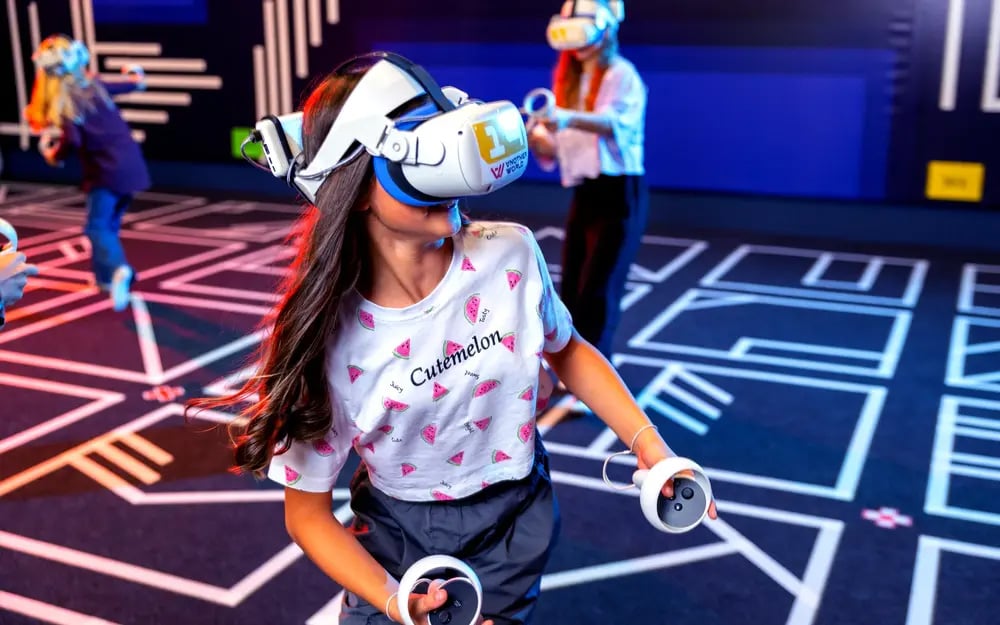 Kids playing VR games at Another World VR Burlington.